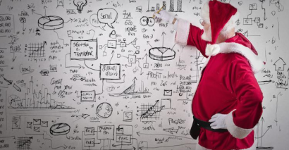 Santa looking at a whiteboard with math equations on it