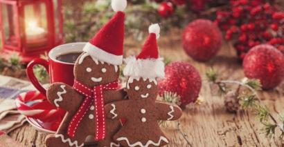 Gingerbread Man & Woman With Santa Hats Reflecting Festive Classroom Activities For EYFS, KS1 & KS2 Pupils